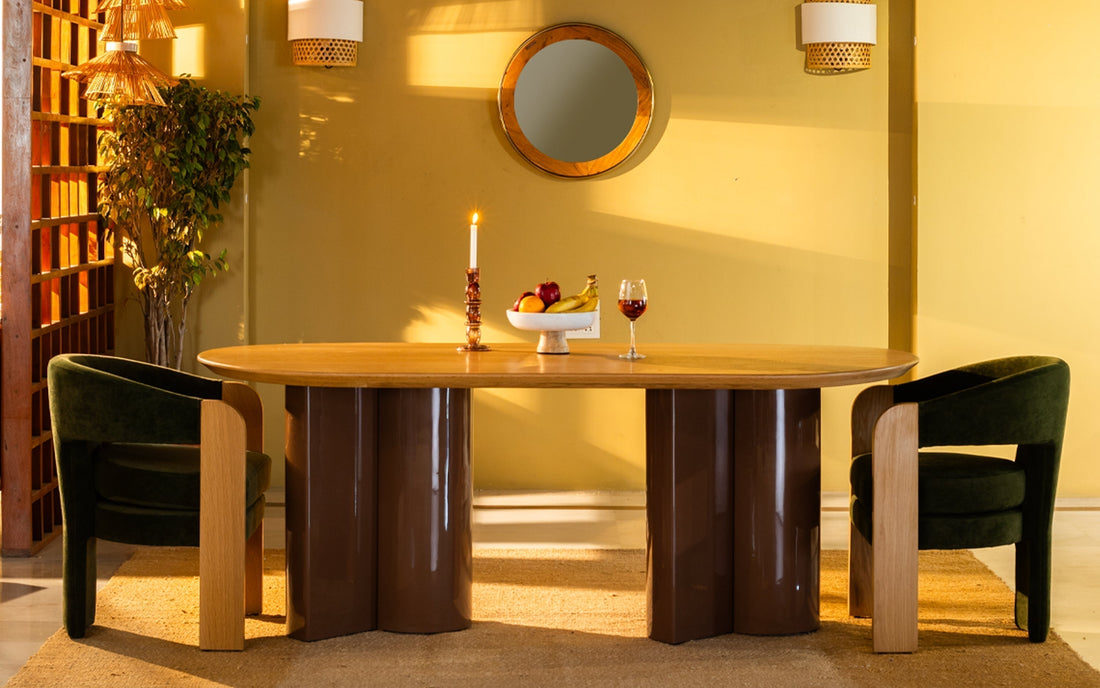 Modern wooden dining table with upholstered chairs in a warm dining room.