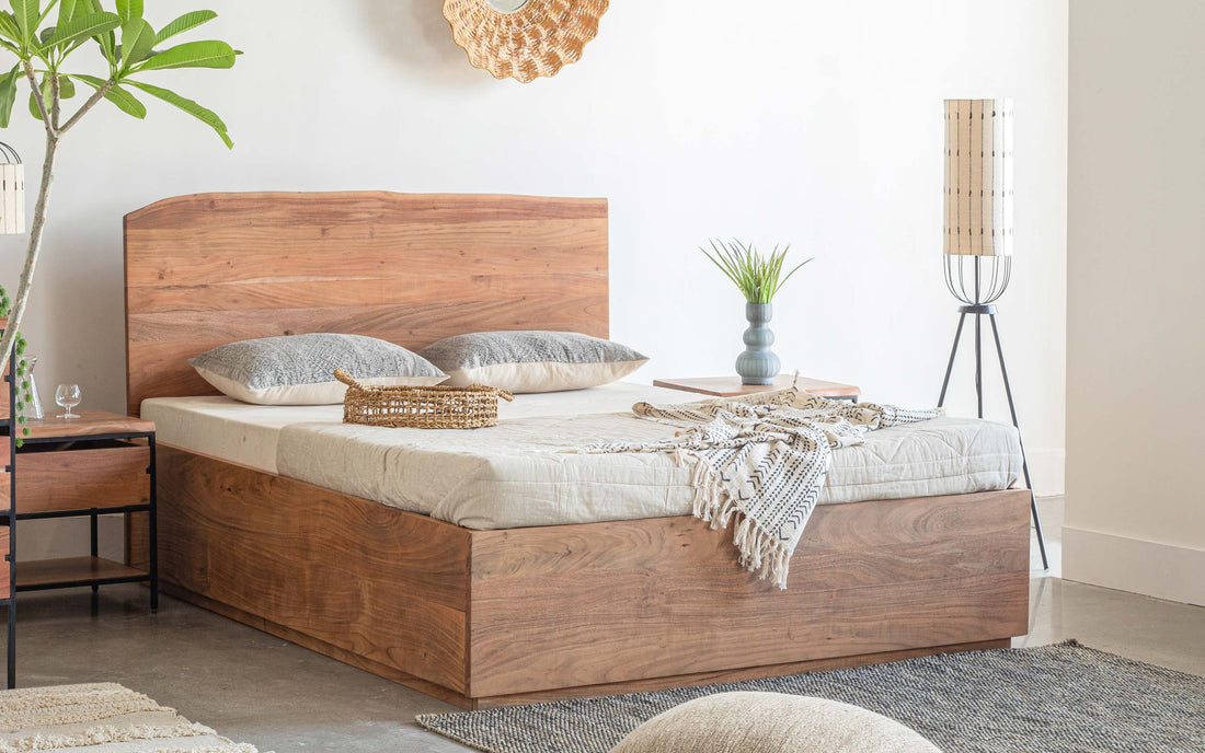 Wooden queen size bed with solid headboard in a modern bedroom