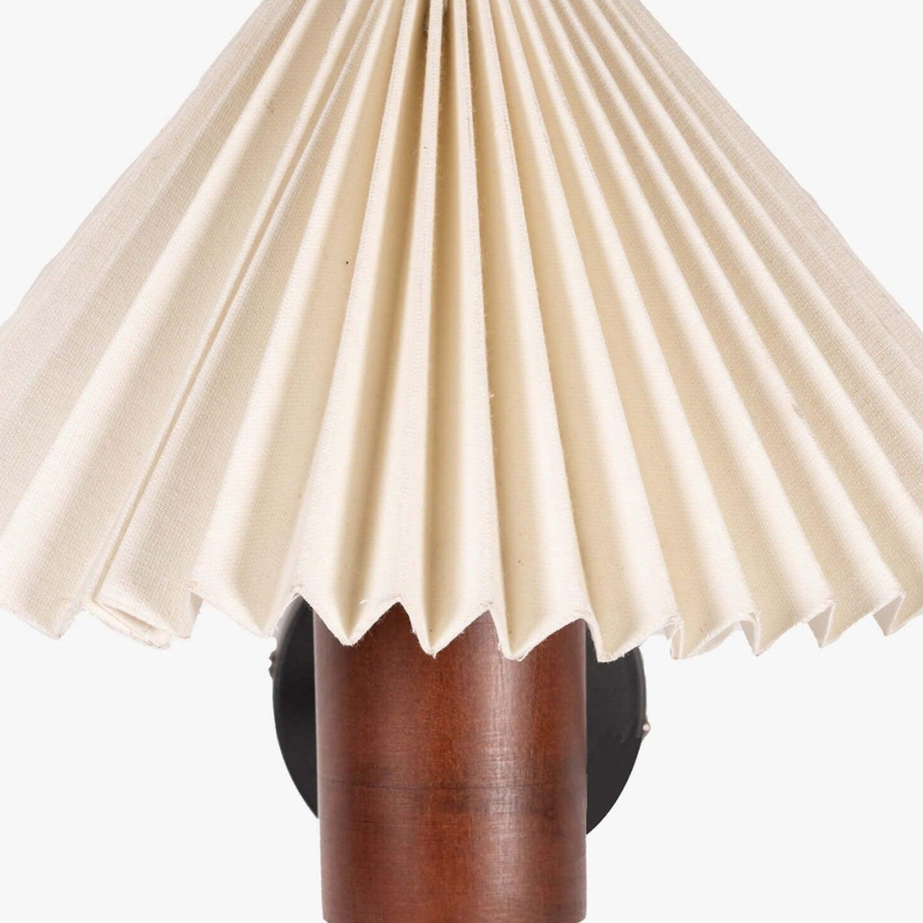 White pleated shade wall lamp with a natural wooden cylindrical base in walnut finish, perfect as a bedside wall lamp or decorative wall sconce for minimalist and vintage interiors.