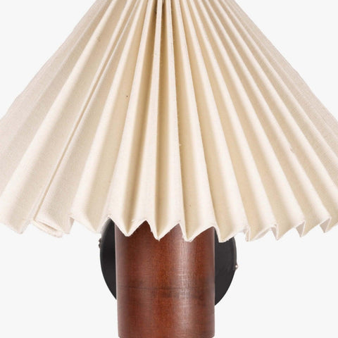 White pleated shade wall lamp with a natural wooden cylindrical base in walnut finish, perfect as a bedside wall lamp or decorative wall sconce for minimalist and vintage interiors.