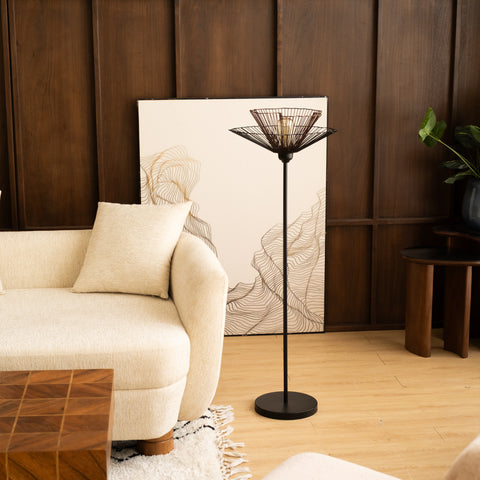 Modern floor lamp with sculptural black and brown metal design.
