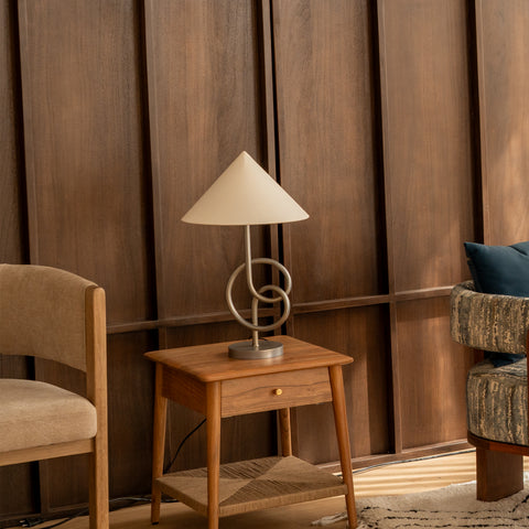 Modern geometric table lamp on wooden side table in living room