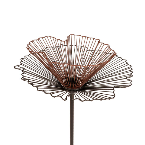Modern floor lamp with sculptural black and brown metal design.