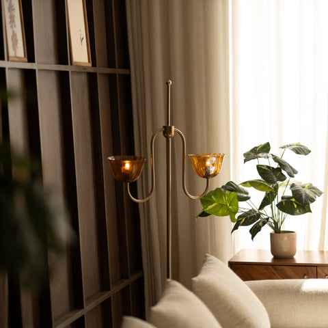 Side profile of the brass floor lamp in a living room.