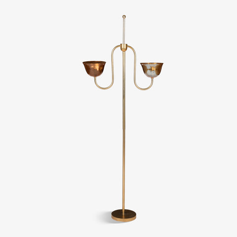 Two-arm brass floor lamp on a white background
