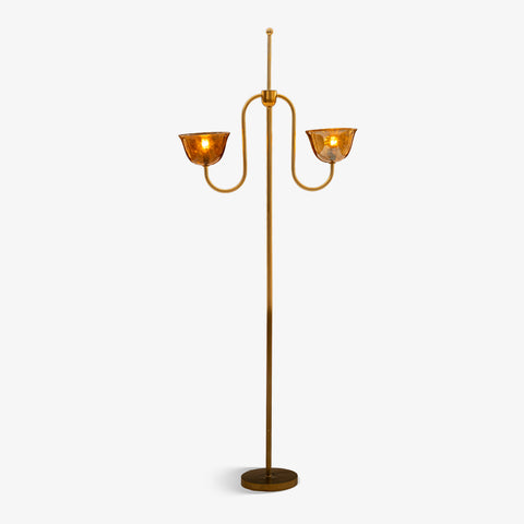 Brass floor lamp isolated on a white background.