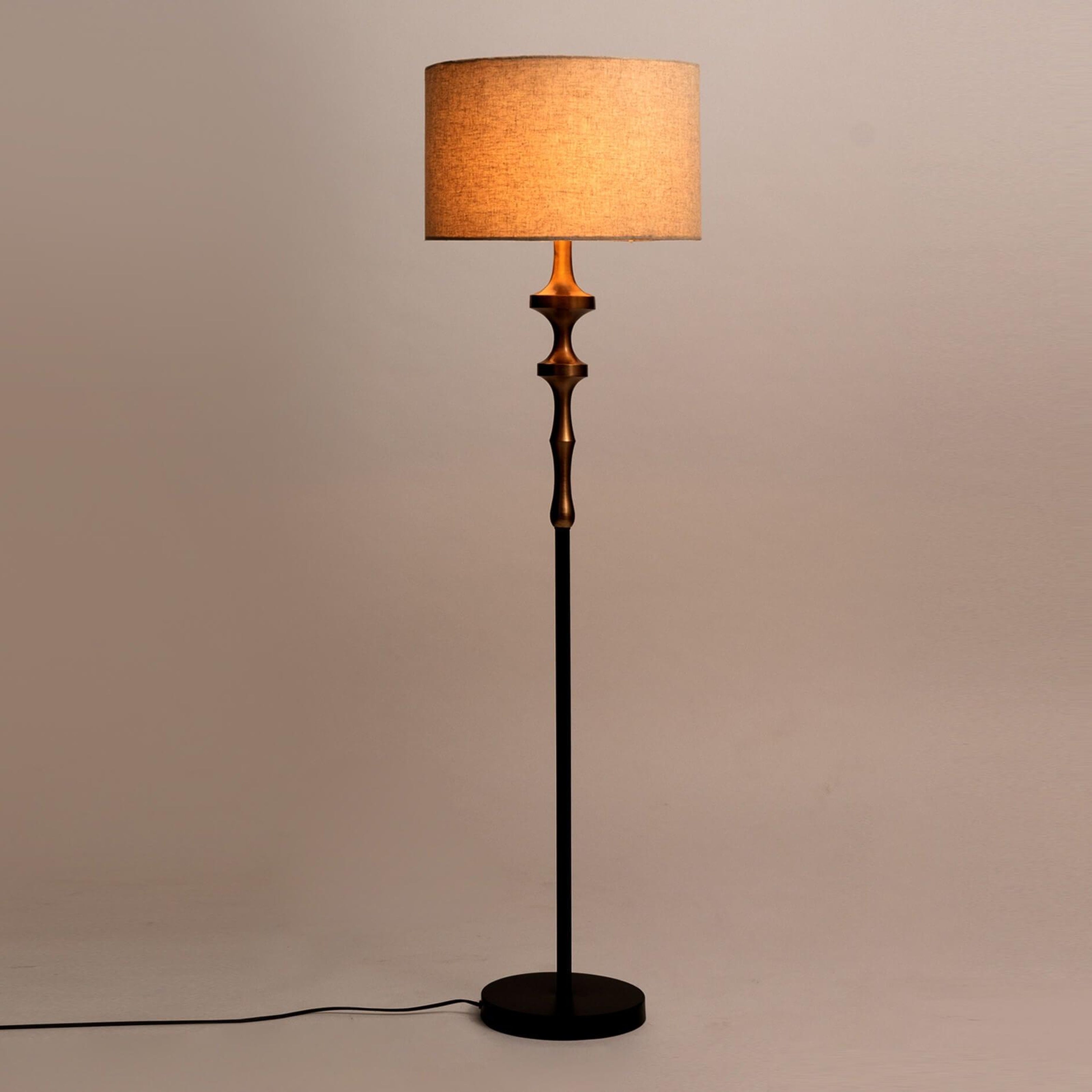 David Floor Lamp with gold plated lamp base, black finish, and natural linen shade. Elegant floor lamp for modern interiors.