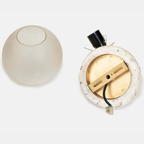 Eros White Wall Lamp with Terrazzo base, Gold-finished Mild Steel, and Frosted Glass shade.  This lamp is available online in India.