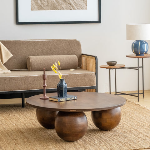 Living room with a brown sofa, wooden coffee table, and side table.