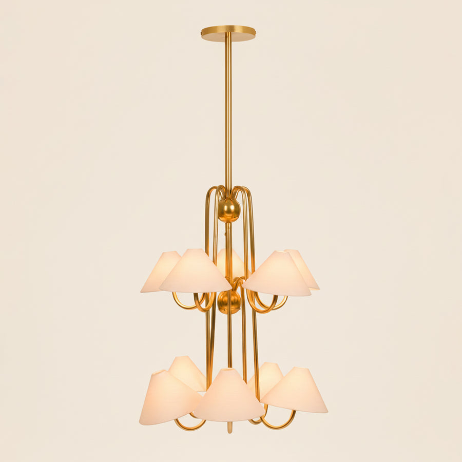 Modern brass chandelier with linen shades, warm ambient ceiling light for living room.