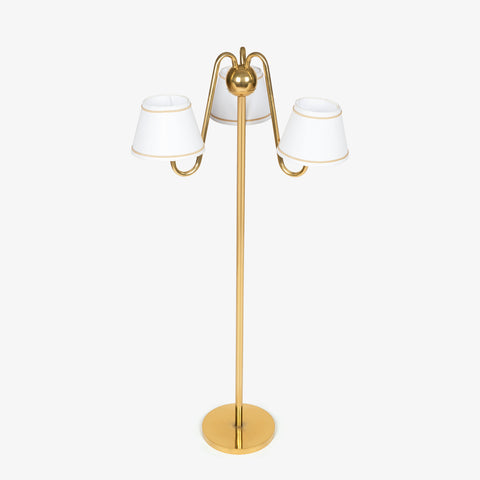 Three-arm floor lamps India design with a brass-finish pole and white shades, a decorative choice for bedroom lamps.