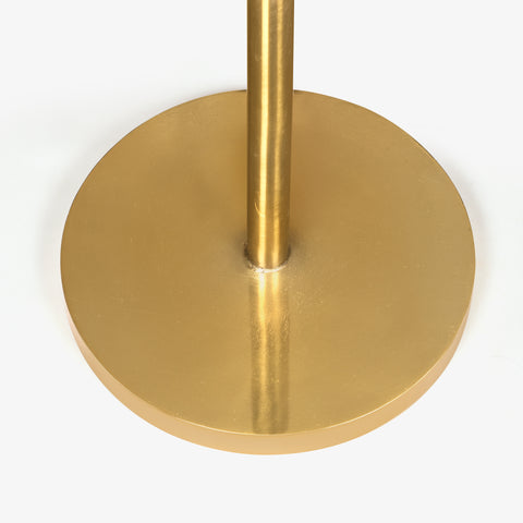 A circular, polished brass-finish base plate for living room long lamps, ensuring stability and style.