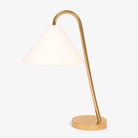 Brass table lamp with fabric shade on white background