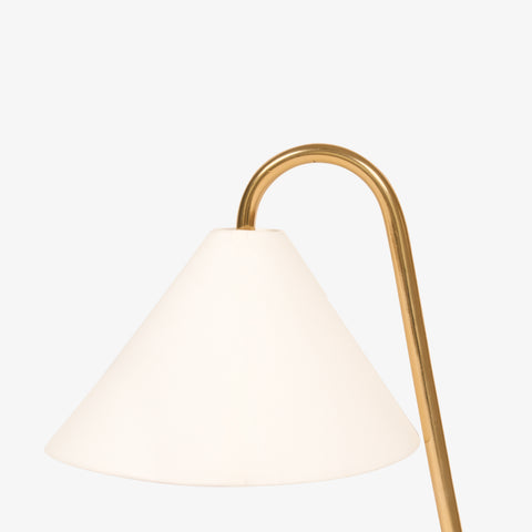 Close-up of fabric shade on brass table lamp