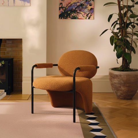 Arden lounge chair in living room setting with plant and decor