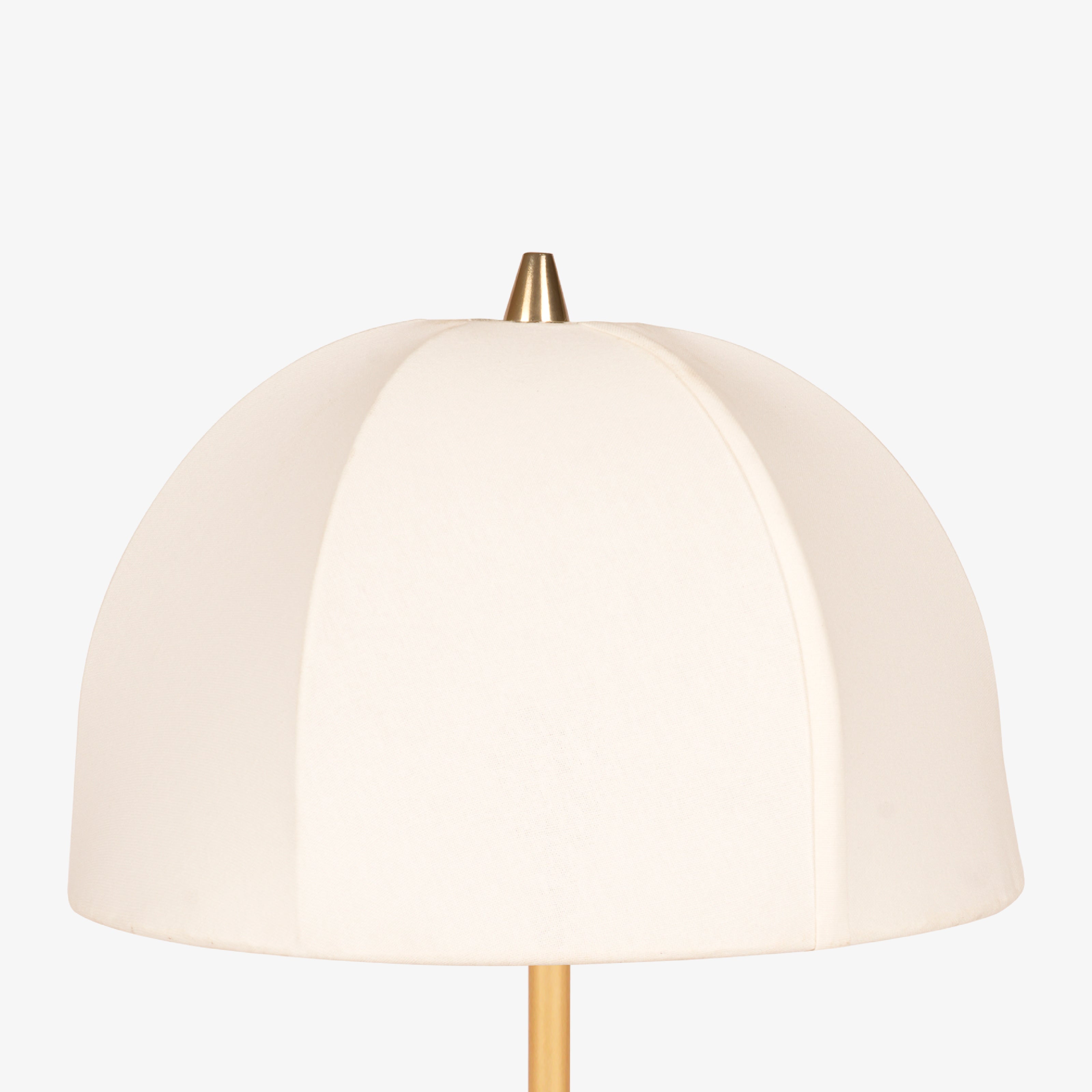 Dome-shaped fabric lampshade with smooth curved panels in soft neutral tone.