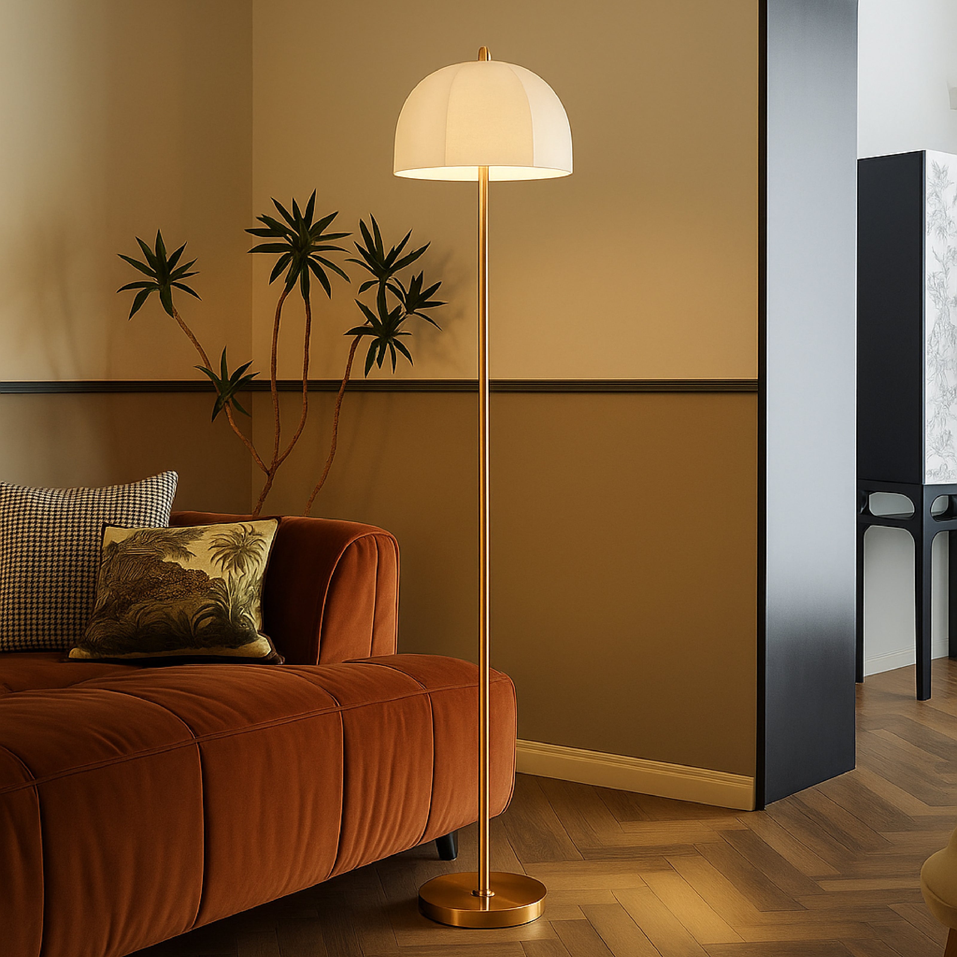 Modern brass floor lamp with dome fabric shade placed beside a sofa in a warm living room interior.