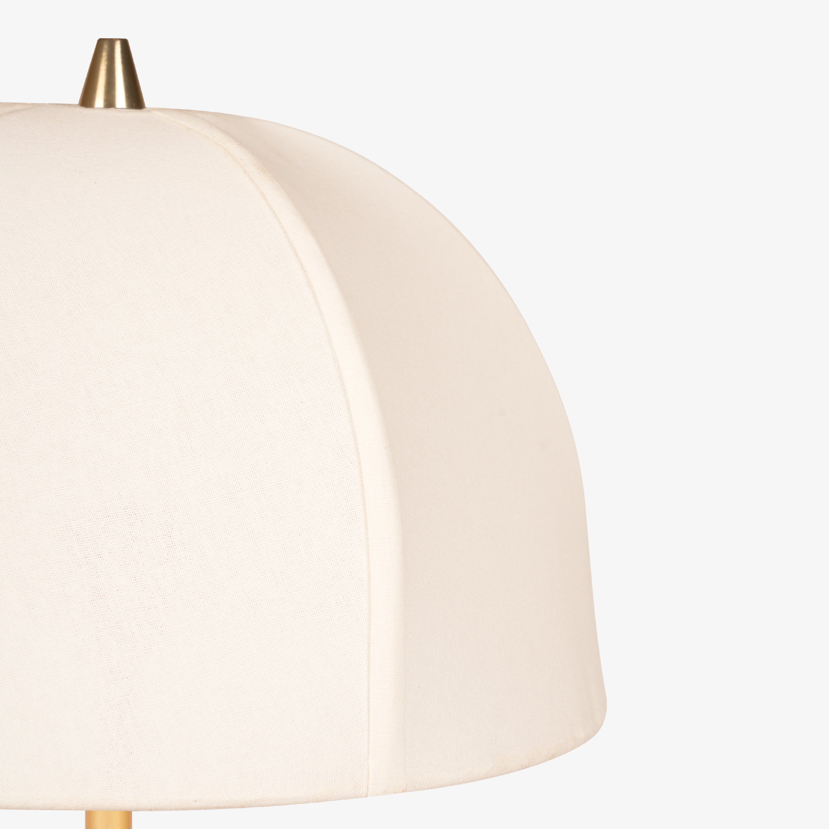 Close-up of curved fabric floor lamp shade showing smooth stitching and soft texture.