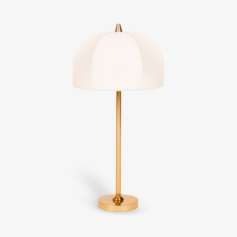 Modern brass table lamp with white fabric shade on white background