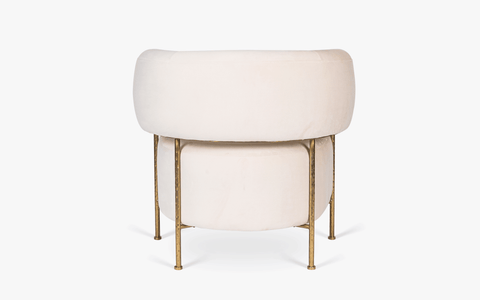 Buda Lounge Chair with modern design, plush upholstery, and hammered texture brass finish on stainless steel legs. Perfect lounge chair for bedroom.