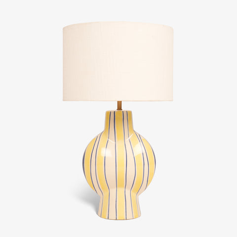 Studio shot of the striped ceramic lamp showing its rounded base profile.