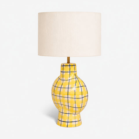 Studio shot of the checkered ceramic table lamp on a white background.