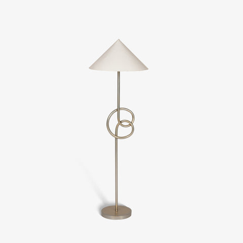 Front view of modern geometric floor lamp with fabric shade whte background