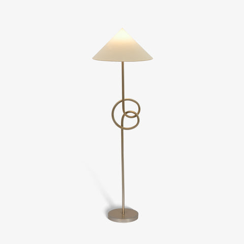 Modern geometric floor lamp glowing with warm light