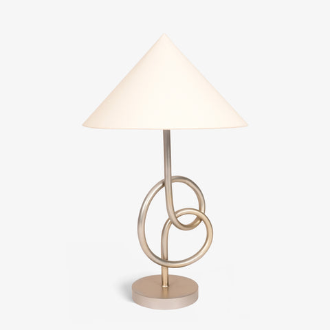 Angled view of modern geometric table lamp with metal ring base