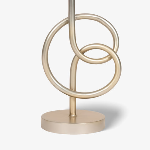 Close-up of geometric metal ring base of table lamp