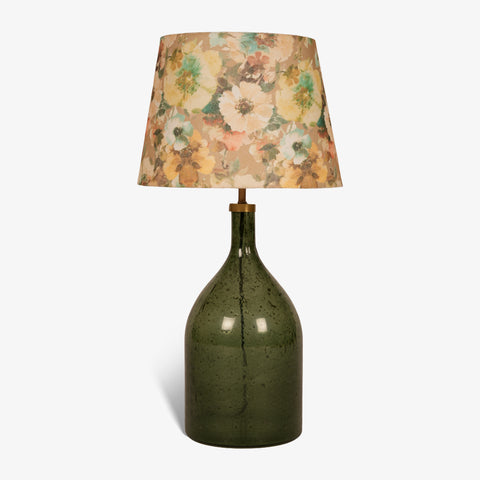 Studio shot of the green glass bottle lamp on a white background.