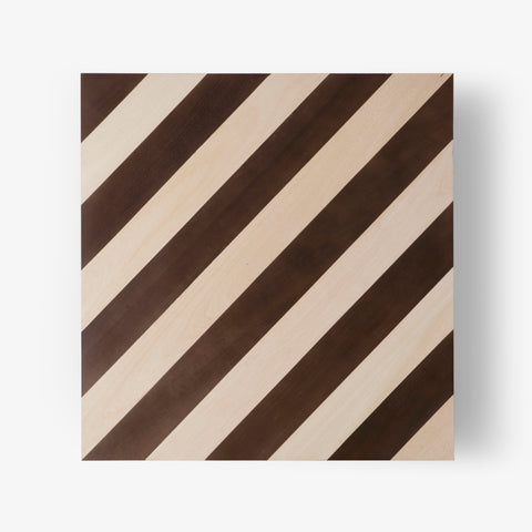 Corner detail of striped wood tabletop