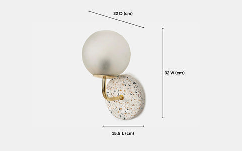 Eros White Wall Lamp with Terrazzo base, Gold-finished Mild Steel, and Frosted Glass shade.  This lamp is available online in India.