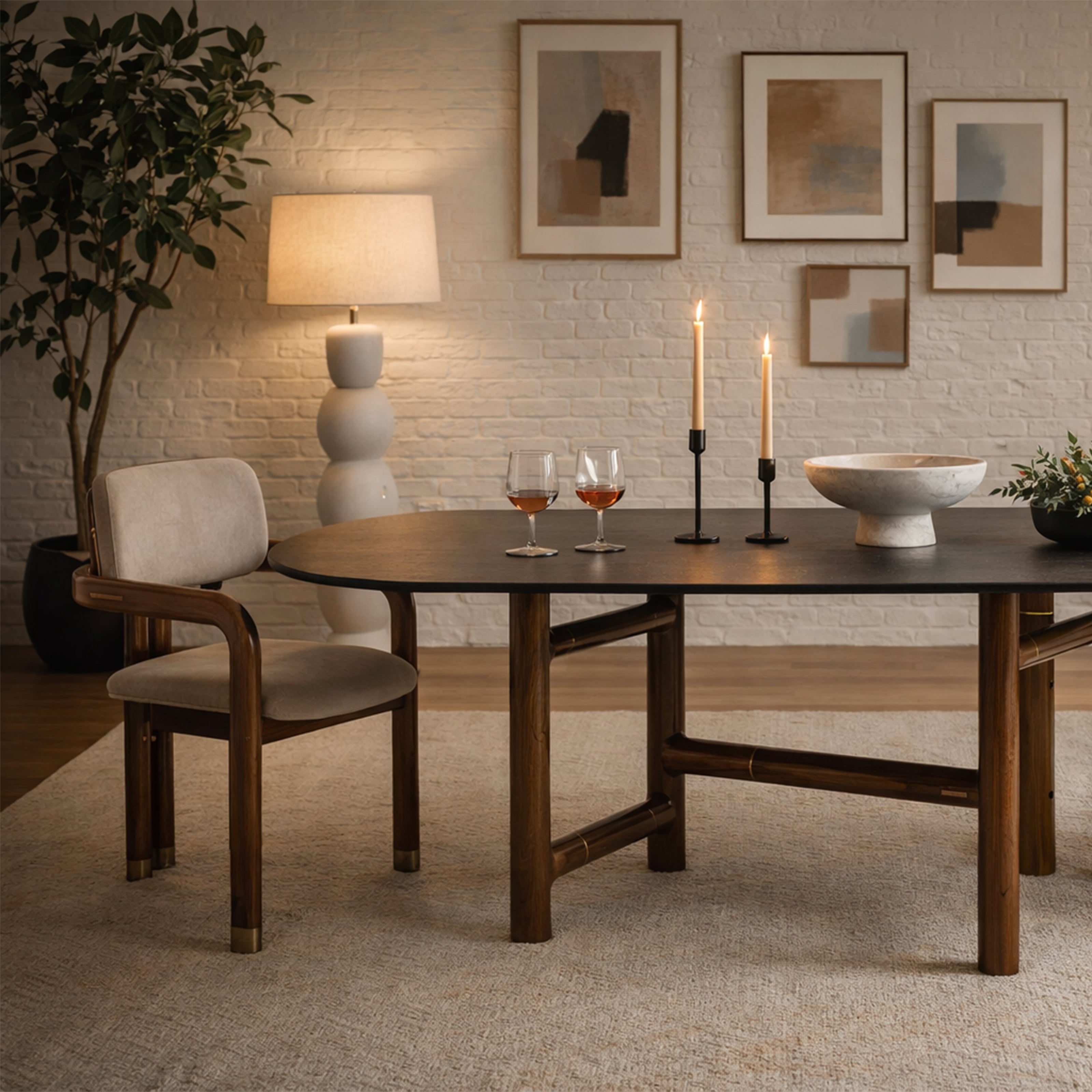A dark wood oval dining table with an architectural trestle base, shown with a matching mid-century modern chair.