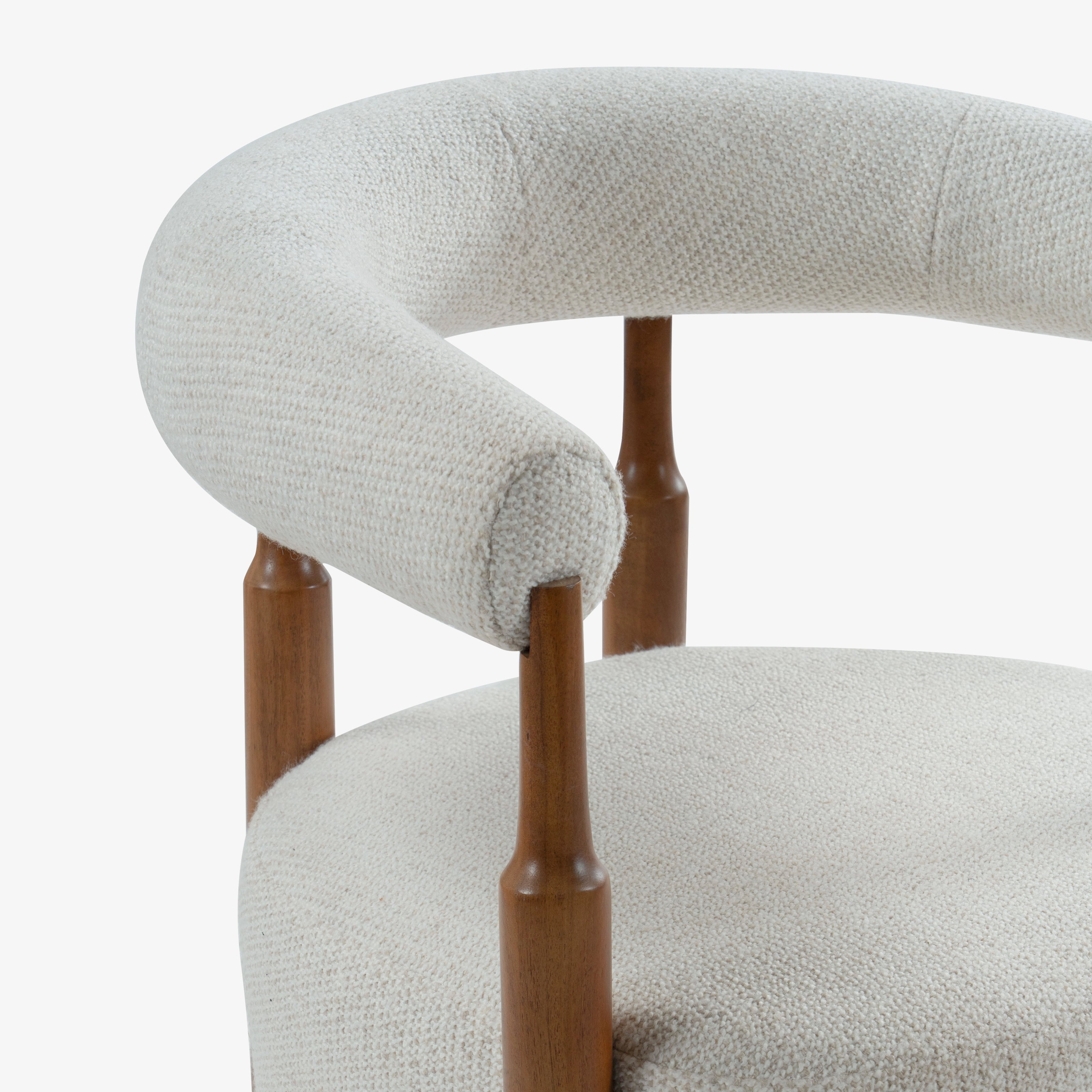 Close-up of curved chair arm back