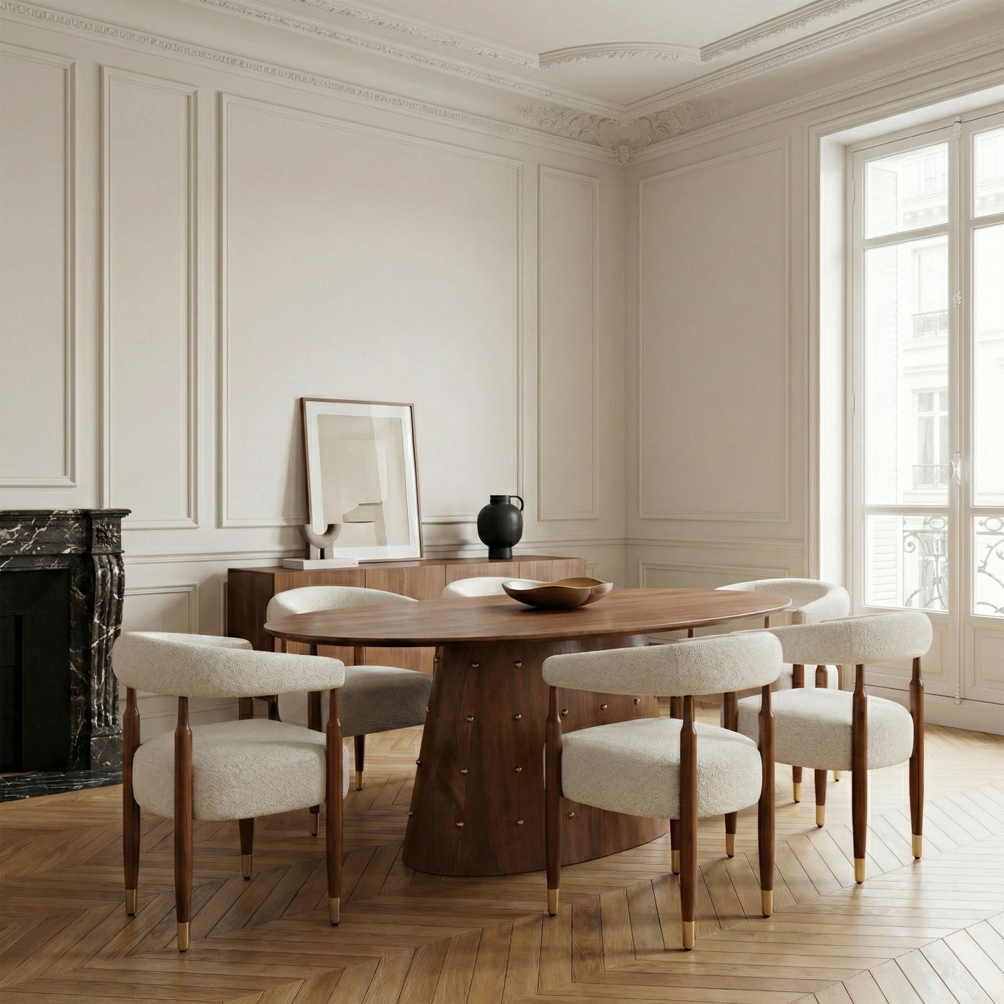 Round wooden dining table in bright room