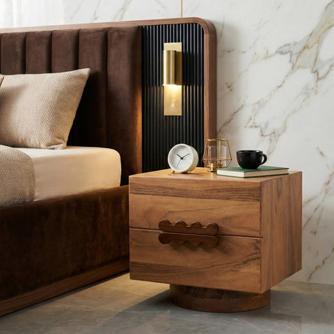 Wood bedside table beside bed