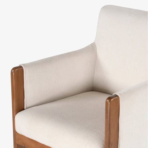 Cream upholstered armchair, close-up