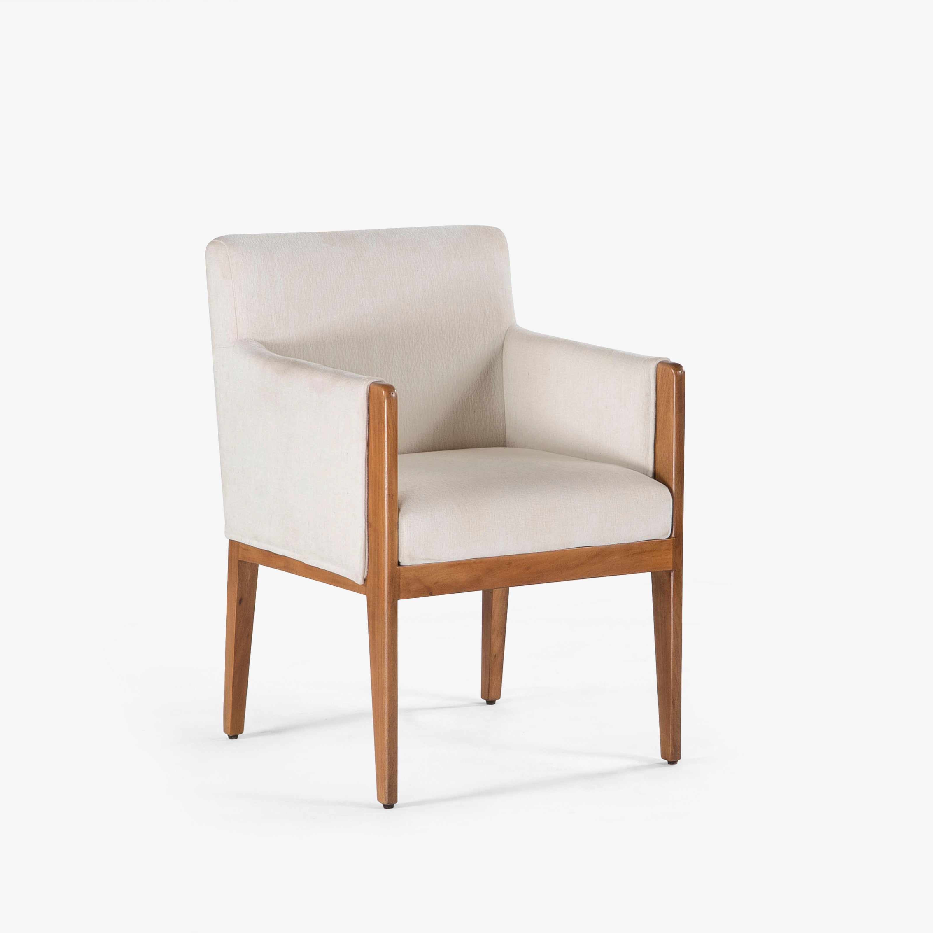 Angled view of upholstered armchair