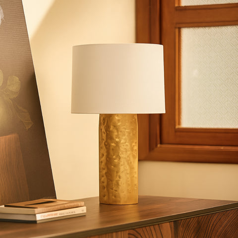 Detailed view of the interlocking brass pillars of these bedroom table lamps.