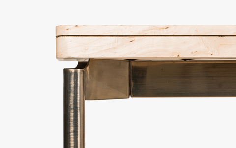 Nouve Wooden Dining Table 6 Seater with curved edges and vintage design, crafted from Burl Veneer and Stainless Steel, with a light-brushed satin brass finish on legs.