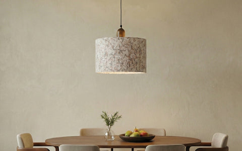 pendant light above a wooden dining table