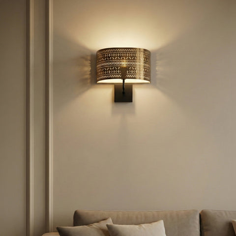 metal wall sconce illuminating a minimalist living room 