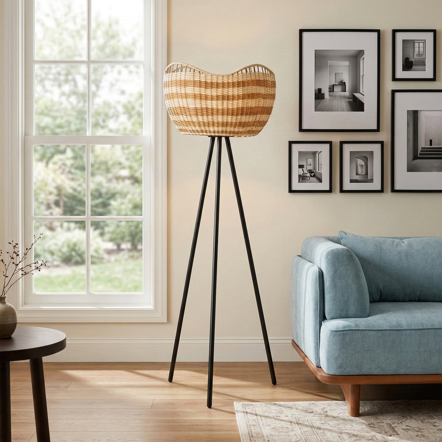 Woven basket floor lamp on black tripod legs in modern living room