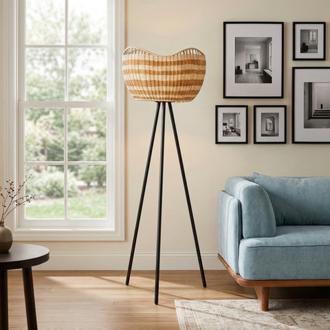 Woven basket floor lamp on black tripod legs in modern living room
