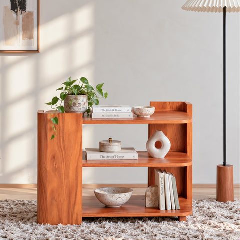 Bow Shelf, a wooden open shelf styled with decor in a contemporary interior