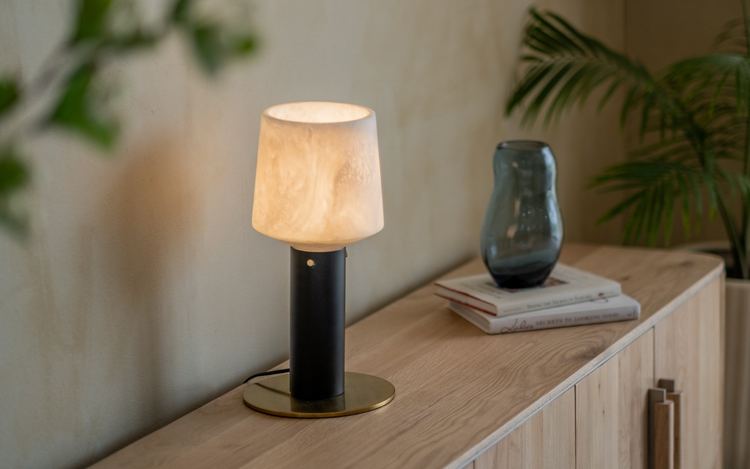 Orira Cylindrical Table Lamp | White Shade & Black Metal base - Close shot - from left angle - Orange Tree