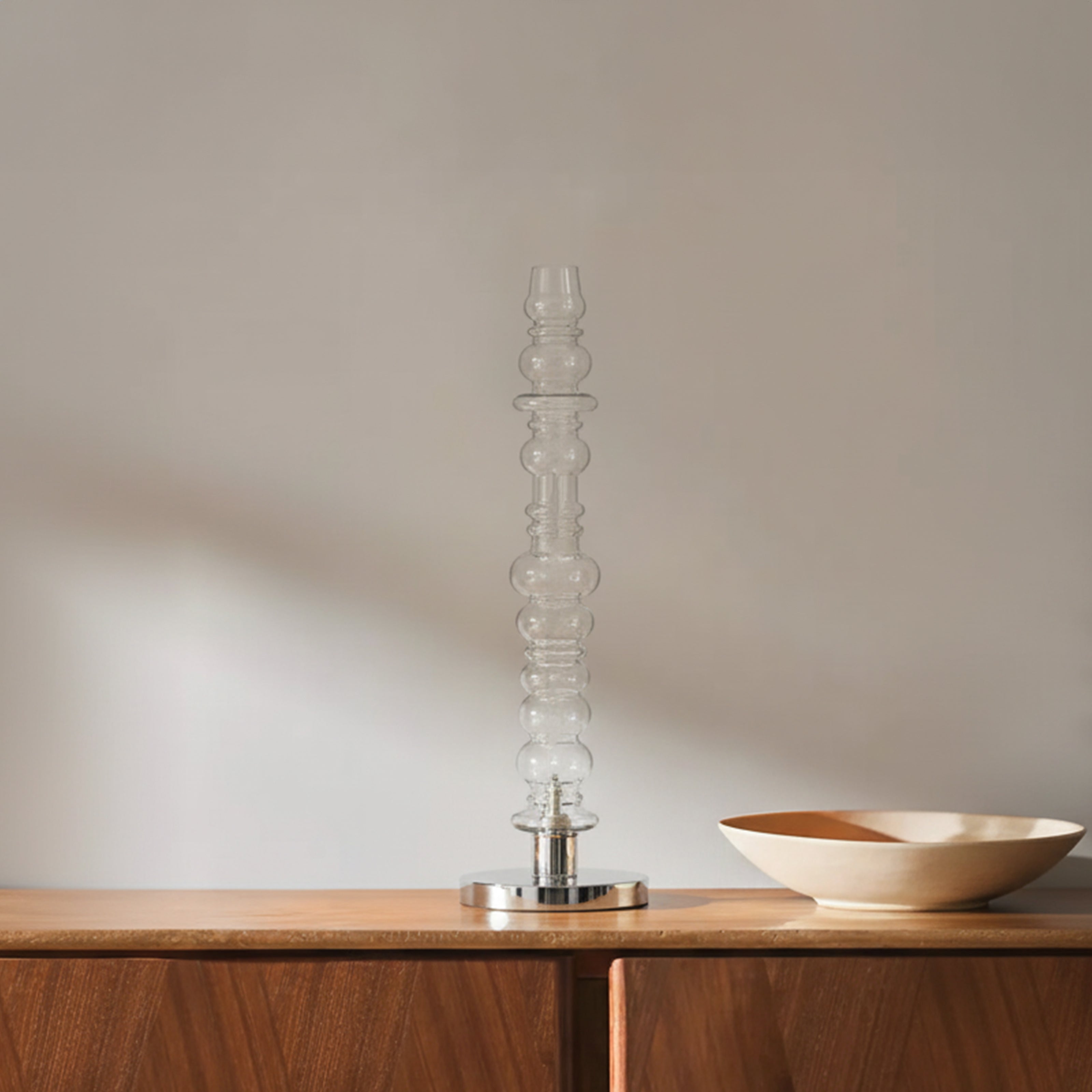 Minimal clear glass table lamp on wooden console, modern table lamp decor