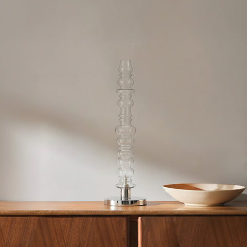 Minimal clear glass table lamp on wooden console, modern table lamp decor