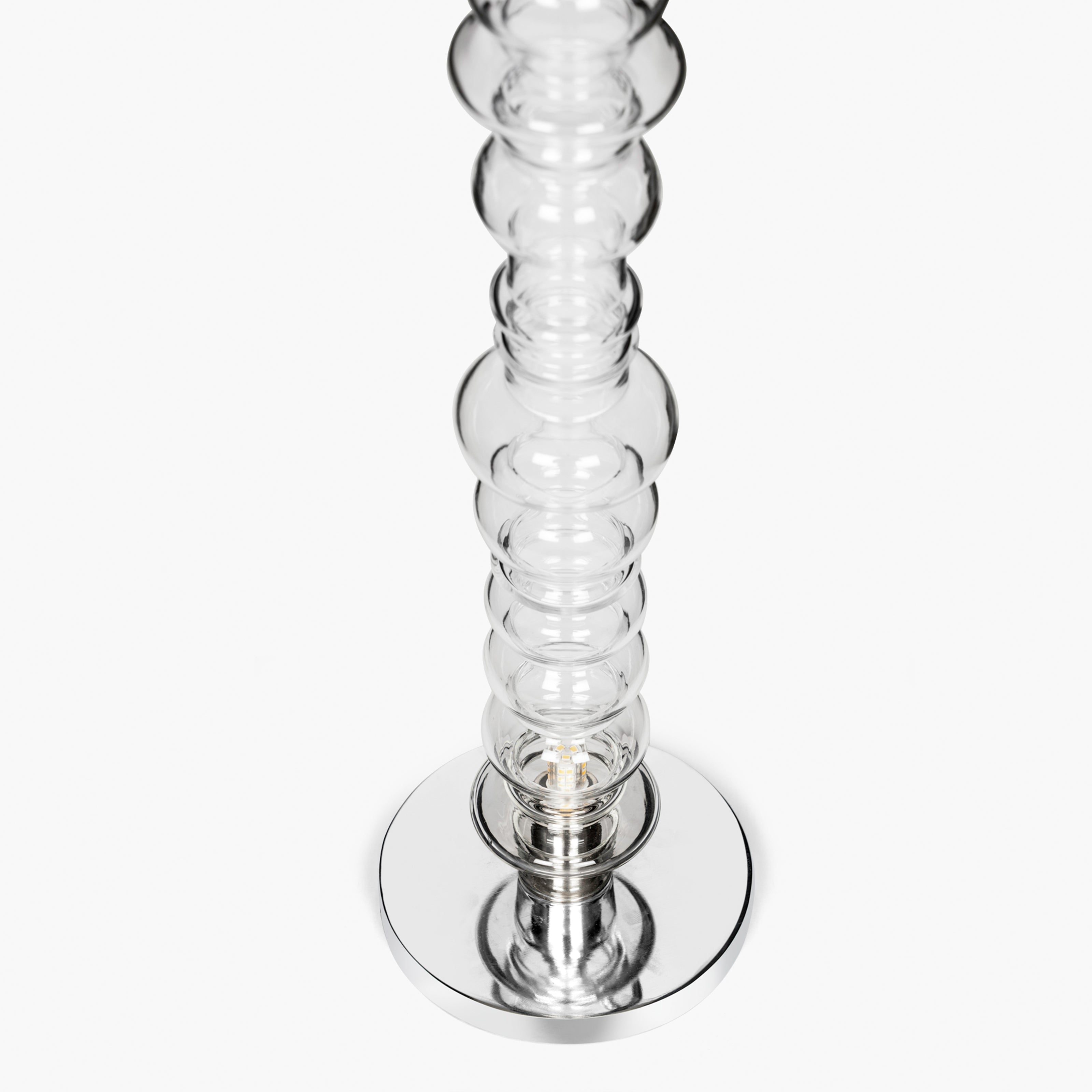 Sculptural clear glass table lamp with stacked glass form and metal base